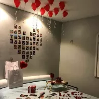 Make a heart out of photos on the wall